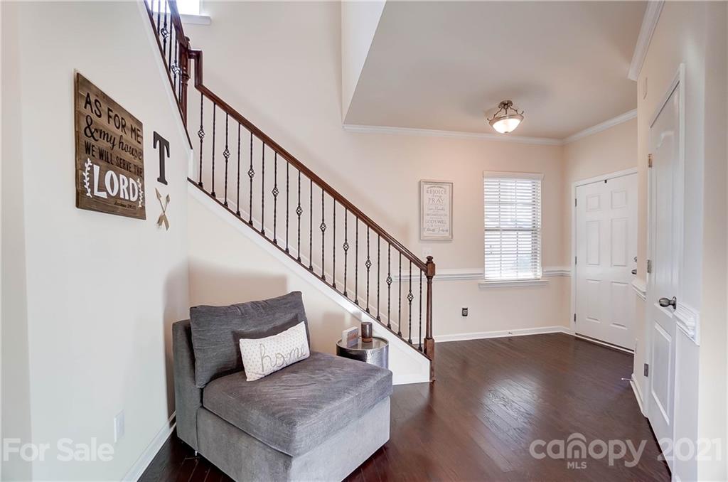 237 Butterfly Place, Unit 198 Tega Cay, SC 29708 - Photo 4 of 26 a view of entryway and hall with wooden floor