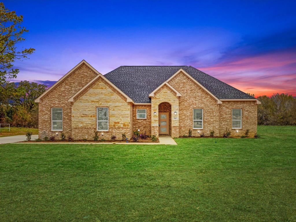 544 Shepherd Road Combine, TX 75159 - Photo 2 of 36 View of front facade with roof with shingles, brick siding, and a lawn
