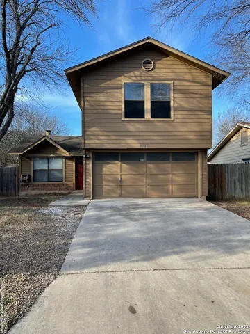 a front view of a house with garage
