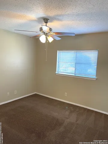 a view of a room with a fan