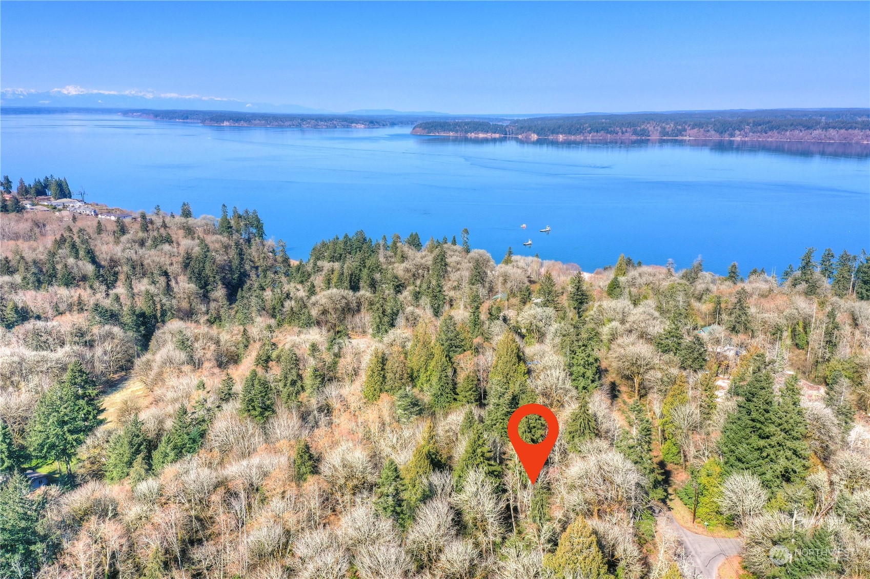 4841 Meridian Road Northeast Olympia, WA 98516 - Photo 2 of 9 a building with an outdoor space and seating area