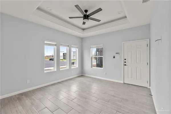 a view of an empty room with a window