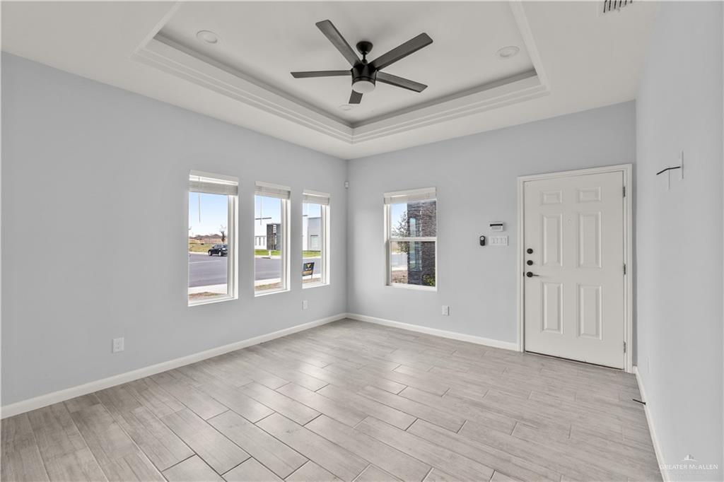 11018 North 33rd Lane, Unit 2 McAllen, TX 78504 - Photo 13 of 17 a view of an empty room with a window