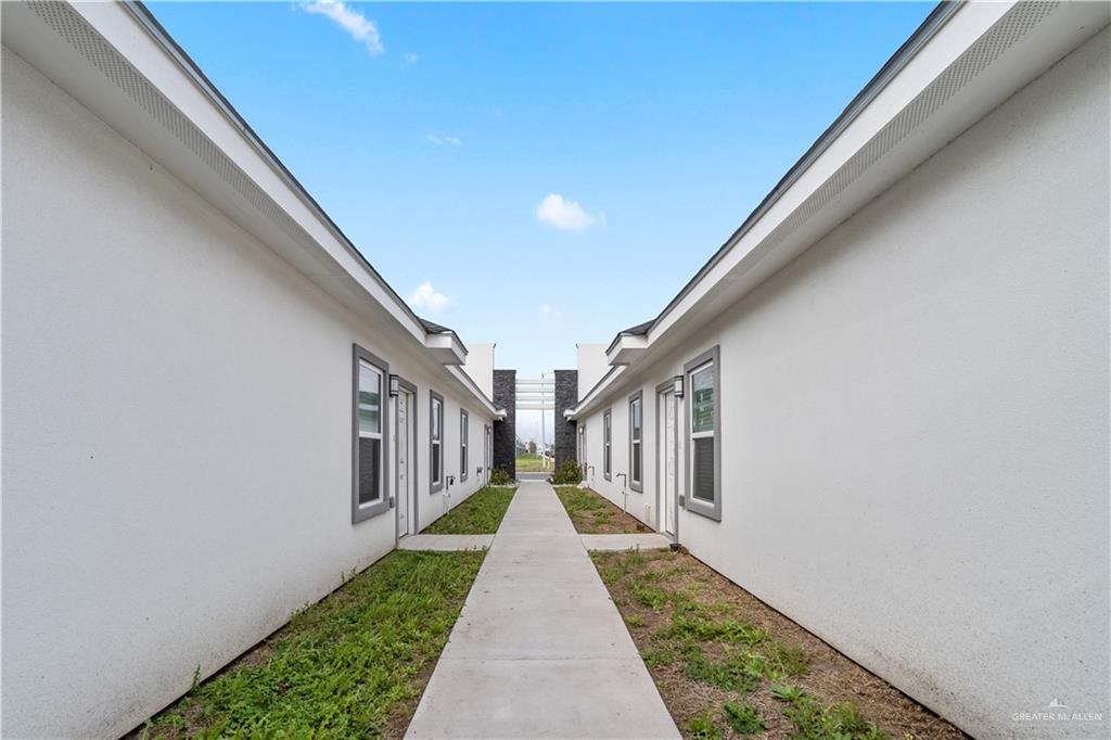 11018 North 33rd Lane, Unit 2 McAllen, TX 78504 - Photo 14 of 17 a view of a pathway both side of house