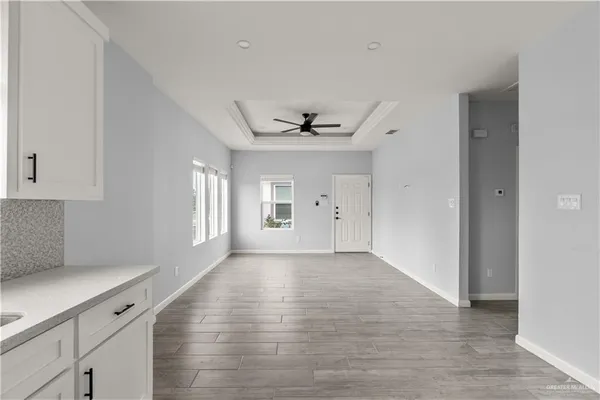 a view of an empty room with a window