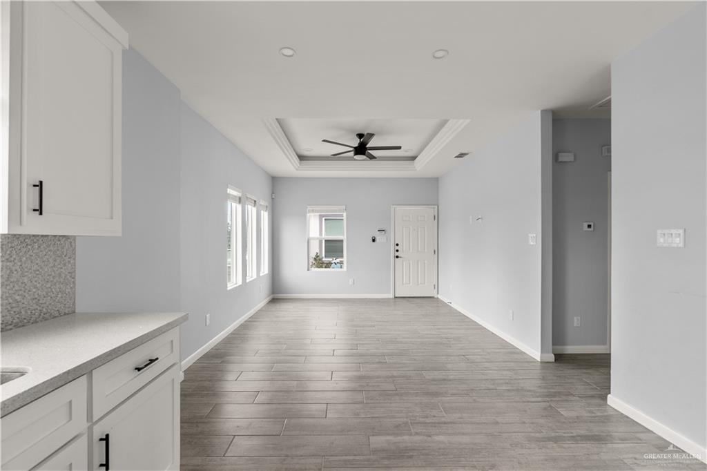 11018 North 33rd Lane, Unit 2 McAllen, TX 78504 - Photo 6 of 17 a view of an empty room with a window