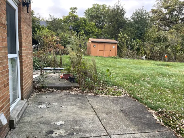 a view of a backyard with a sitting area