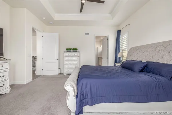 a bedroom with a bed and a view of bedroom