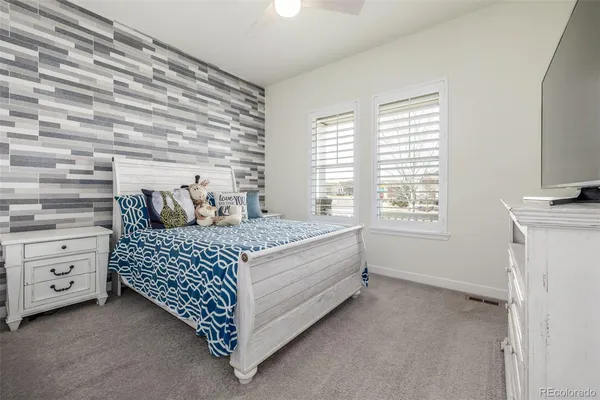 a bed room with a bed and a window