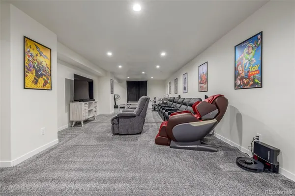 a living room with furniture a flat screen tv and a window