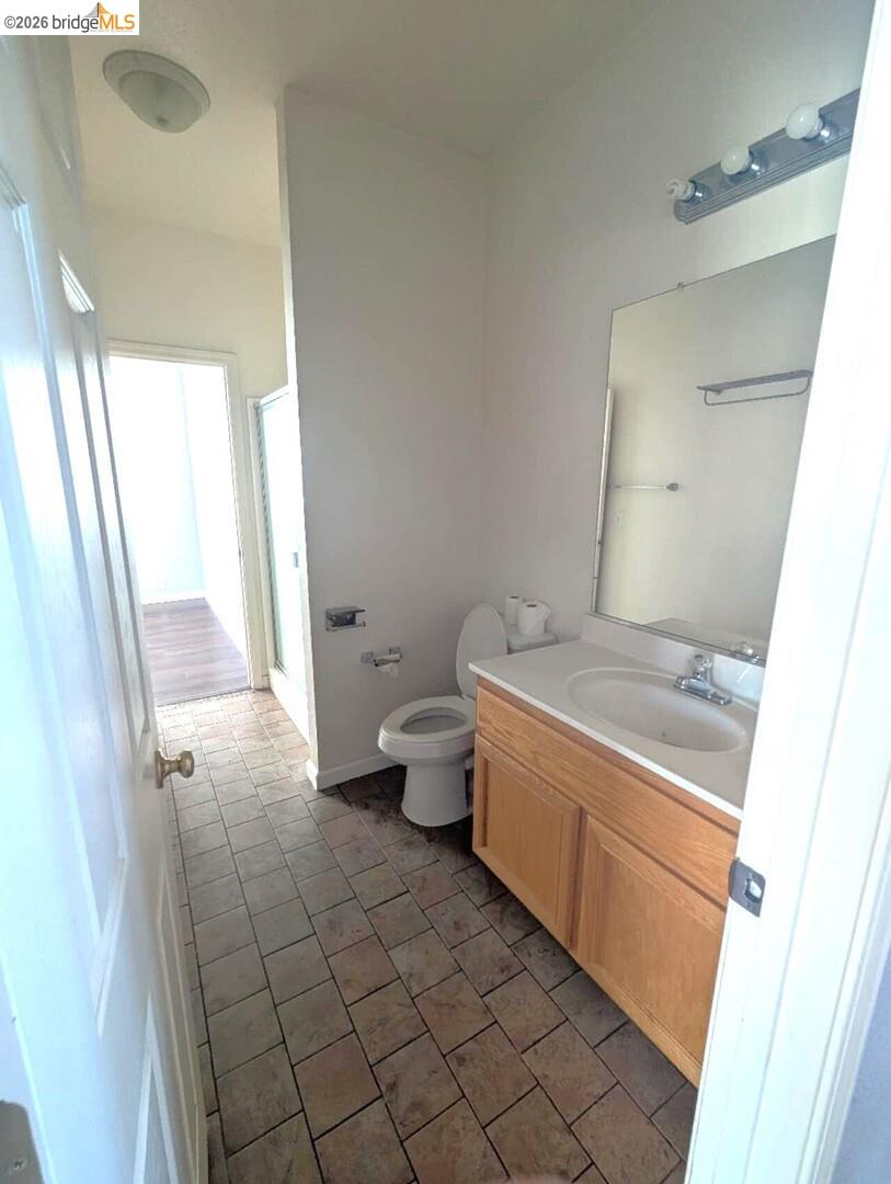 4958 Bay View Circle Stockton, CA 95219 - Photo 18 of 24 full bath featuring vanity, a stall shower, and light tile patterned floors