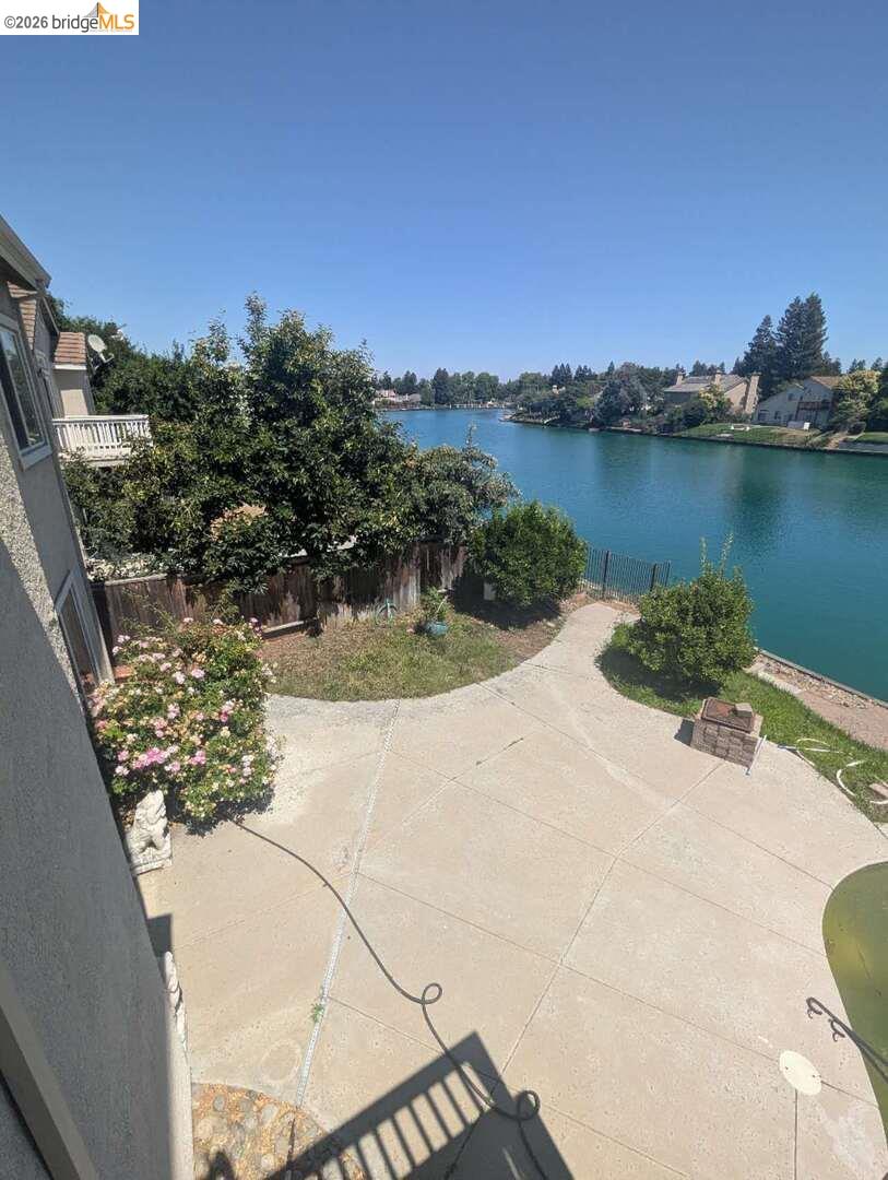 4958 Bay View Circle Stockton, CA 95219 - Photo 21 of 24 fenced backyard with a water view and a patio