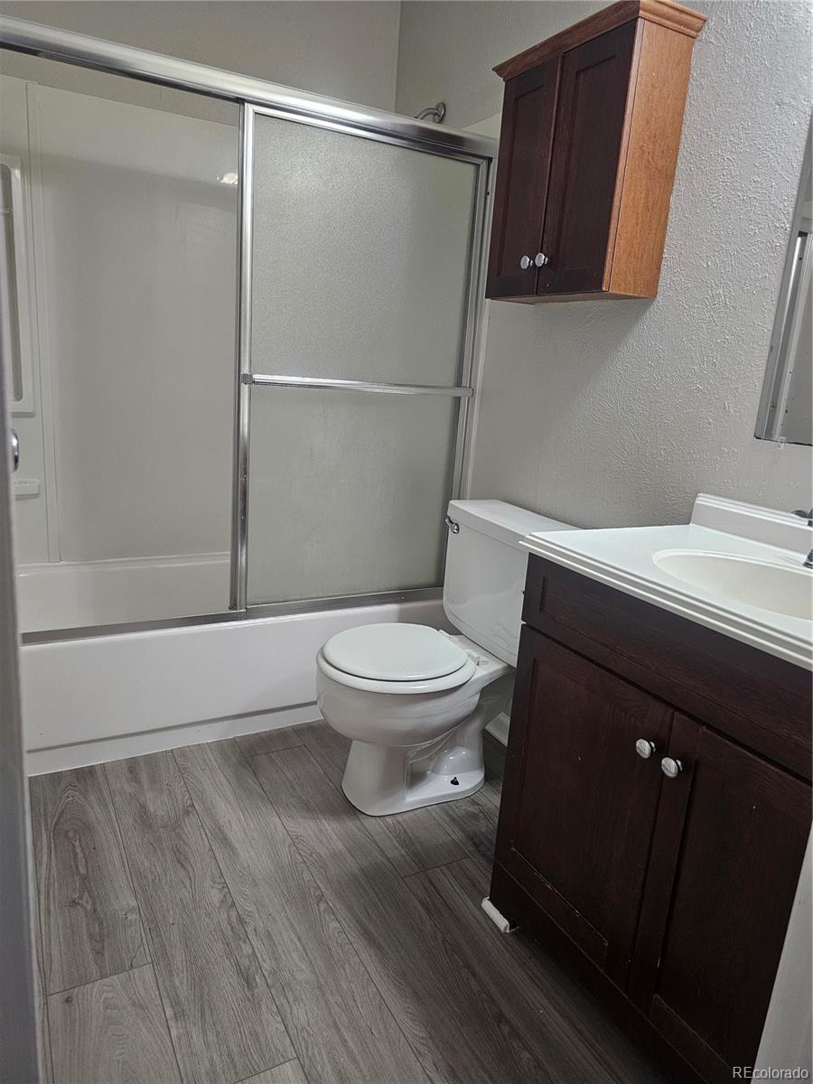 1050 South Monaco Parkway, Unit 93 Denver, CO 80224 - Photo 12 of 20 a bathroom with a toilet and a shower