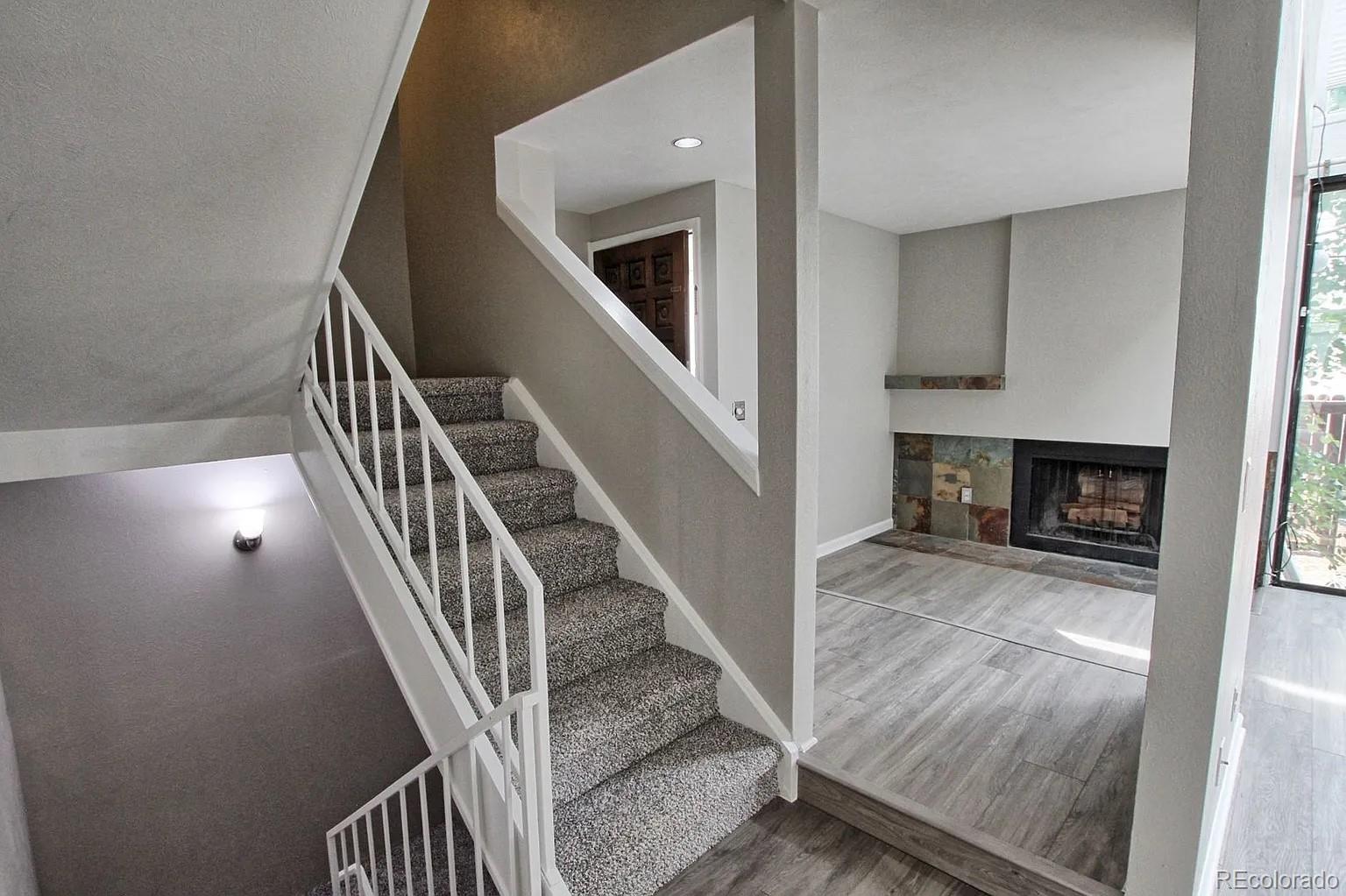 1050 South Monaco Parkway, Unit 93 Denver, CO 80224 - Photo 8 of 20 a view of entryway and hall with wooden floor