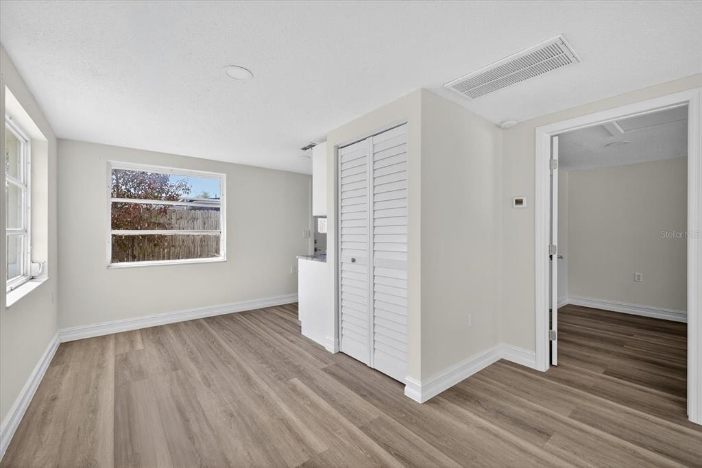 5409 Oceanic Road Holiday, FL 34690 - Photo 19 of 34 a view of an empty room with wooden floor and a window