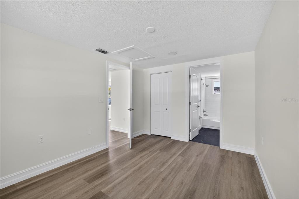 5409 Oceanic Road Holiday, FL 34690 - Photo 27 of 34 a view of a room with wooden floor and white walls
