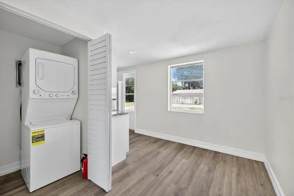 a view of hallway with wooden floor