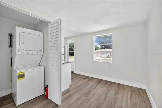 a view of hallway with wooden floor