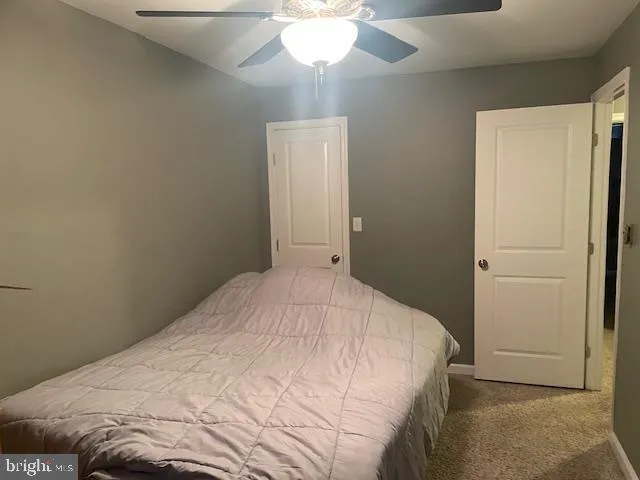 a view of a patio with table and chairs