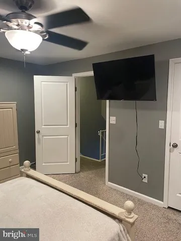 a view of a livingroom with a bathroom and a shower