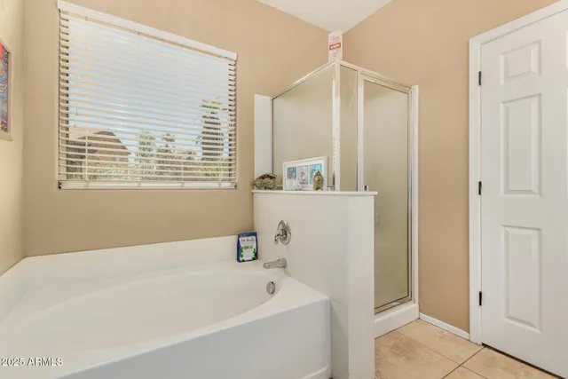 a white bath tub sitting next to a white sink