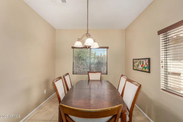 a view of a dining room with furniture window and outside view