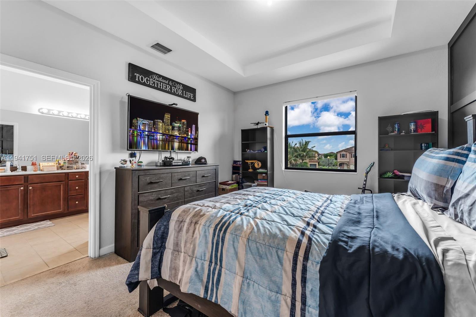 3763 Southeast 2nd Street Homestead, FL 33033 - Photo 13 of 48 a bed sitting in a bedroom and tv