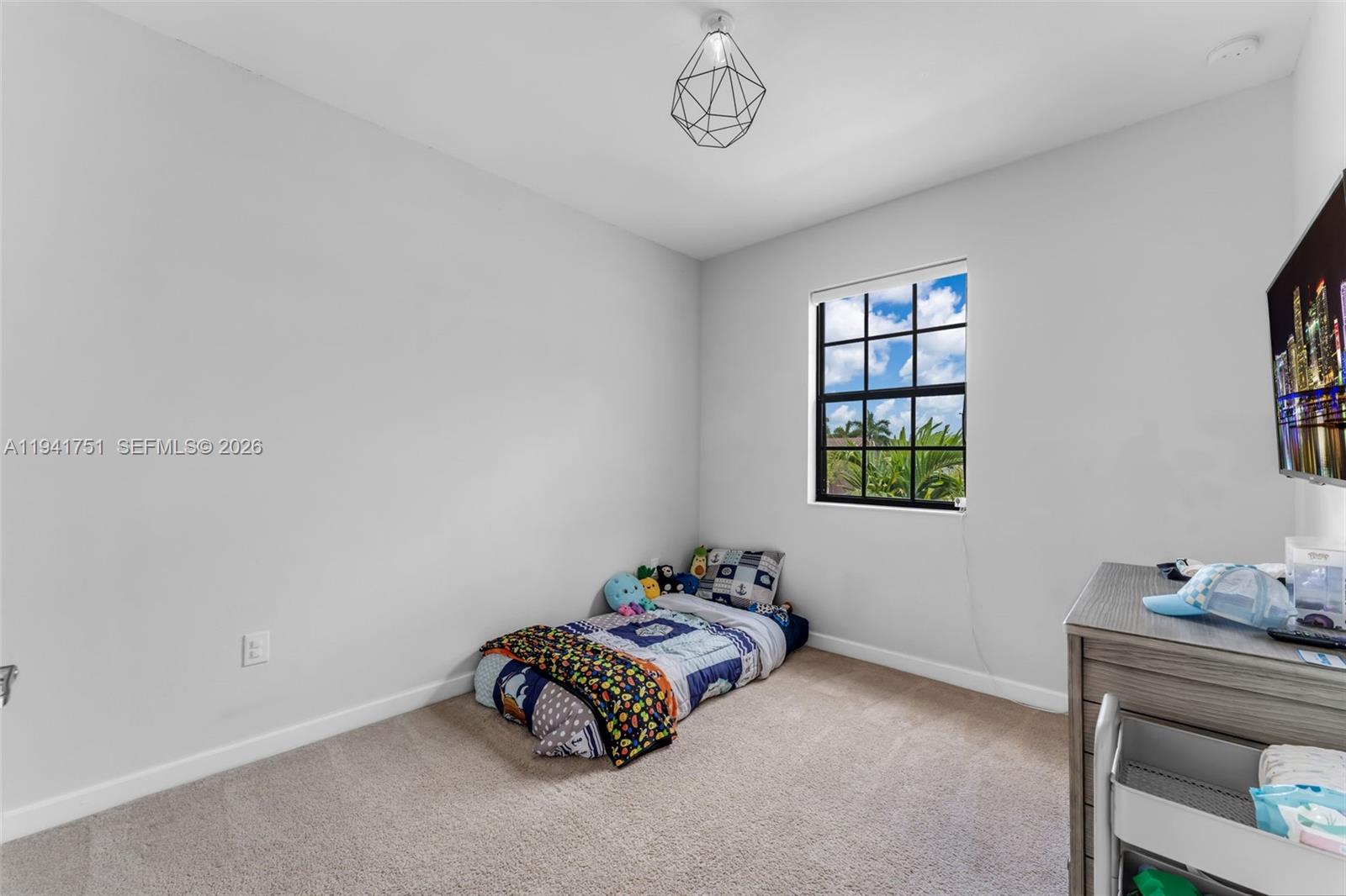 3763 Southeast 2nd Street Homestead, FL 33033 - Photo 19 of 48 a bedroom with a bed and a window