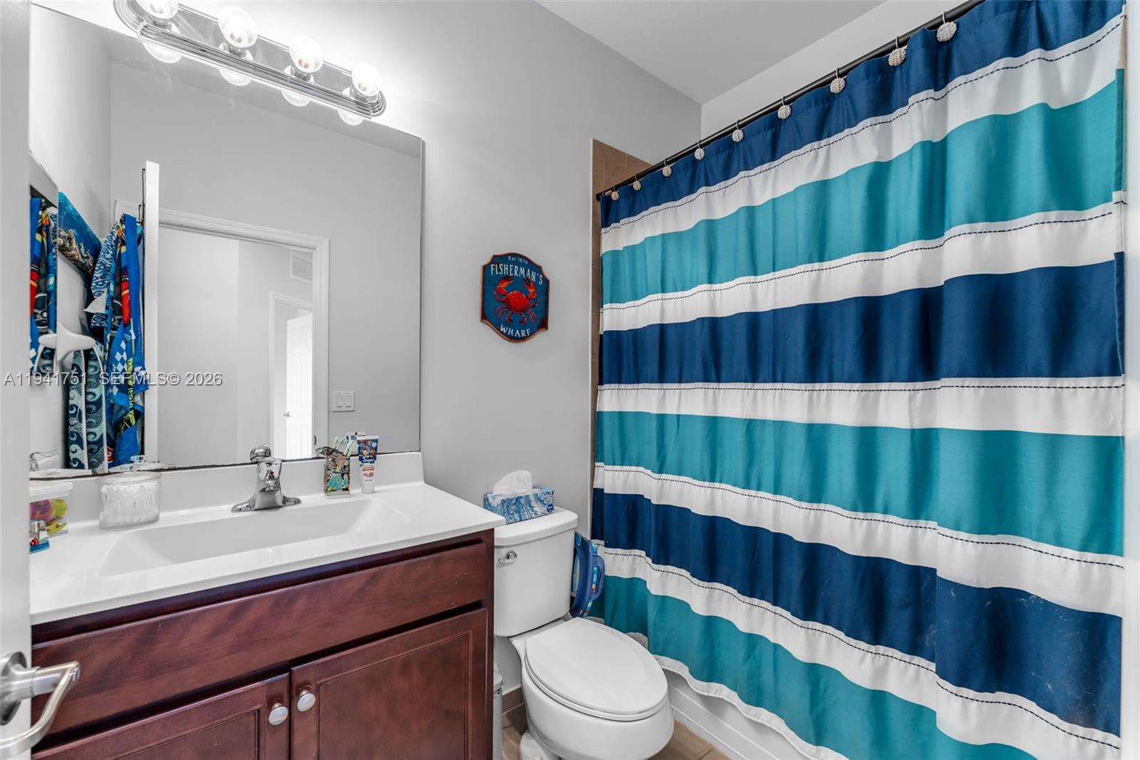 3763 Southeast 2nd Street Homestead, FL 33033 - Photo 20 of 48 a bathroom with a sink and a mirror