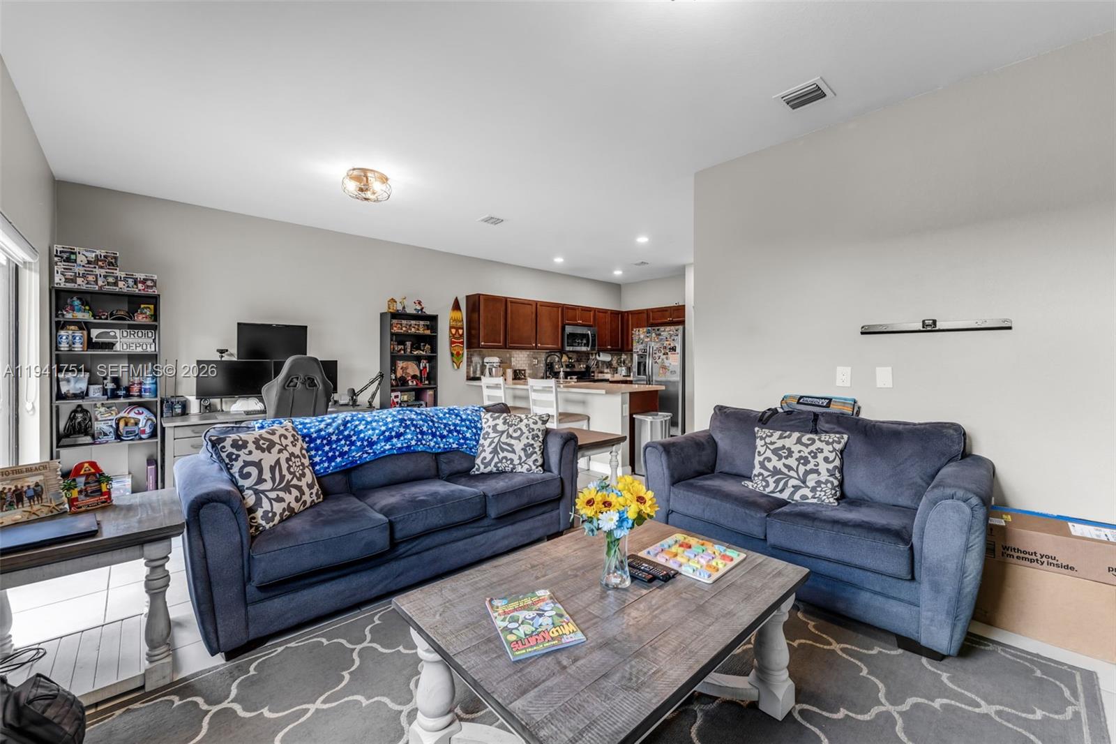 3763 Southeast 2nd Street Homestead, FL 33033 - Photo 2 of 48 a living room with furniture and a wooden floor