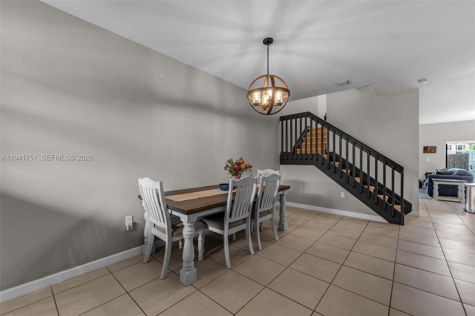 3763 Southeast 2nd Street Homestead, FL 33033 - Photo 3 of 48 a view of a dining room and a chandelier