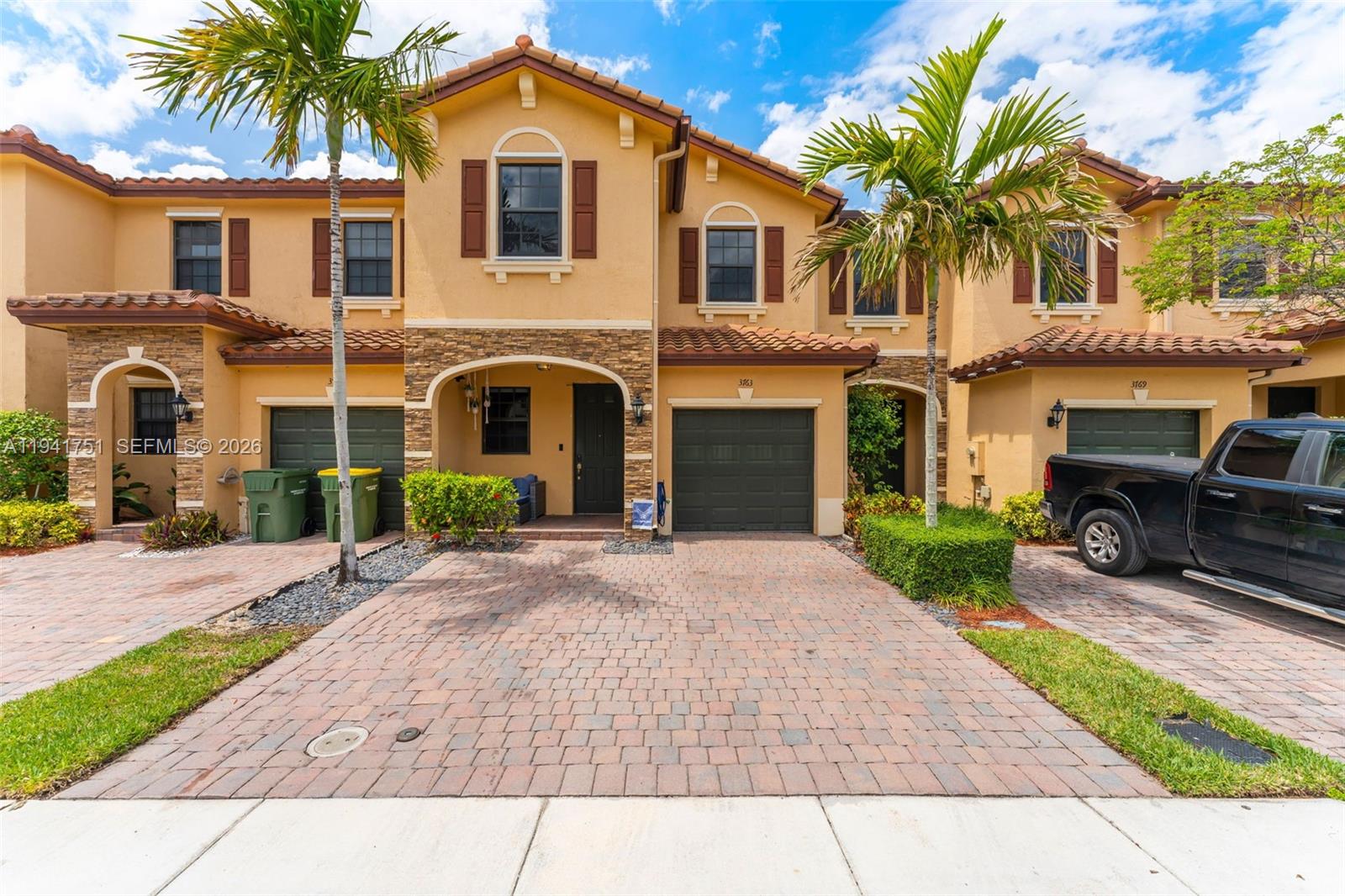 3763 Southeast 2nd Street Homestead, FL 33033 - Photo 48 of 48 a front view of a house with a yard and garage