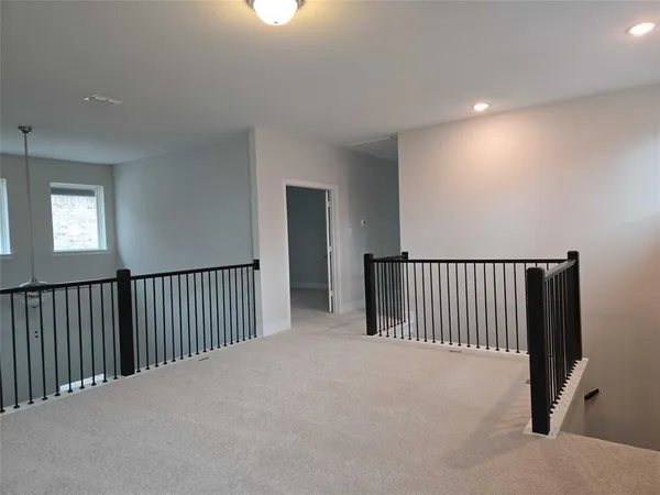 a view of a hallway with a window