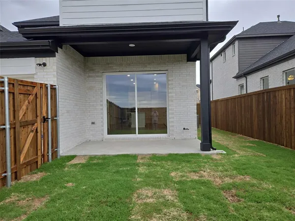 a view of front door and yard