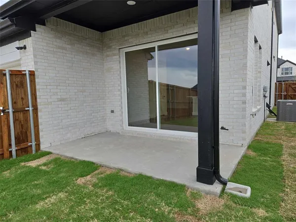 a view of backyard with entertaining space