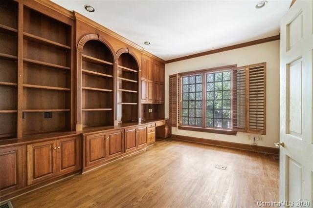 8355 Providence Road Charlotte, NC 28270 - Photo 11 of 36 a view of an empty room with a window and wooden floor