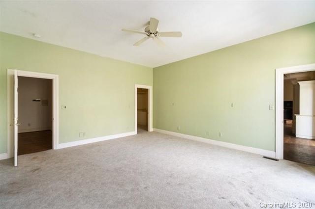 8355 Providence Road Charlotte, NC 28270 - Photo 19 of 36 a view of an empty room with a ceiling fan