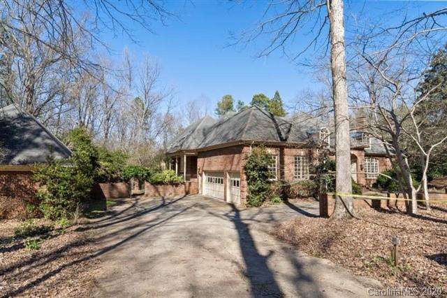 8355 Providence Road Charlotte, NC 28270 - Photo 3 of 36 a view of a house with backyard and a tree