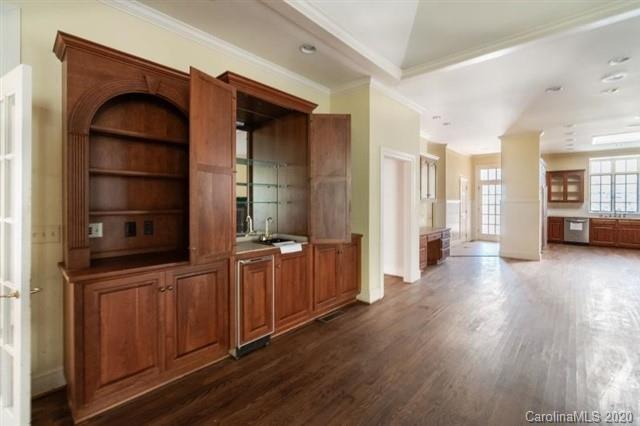 8355 Providence Road Charlotte, NC 28270 - Photo 22 of 36 a view of a hallway with wooden floor and windows
