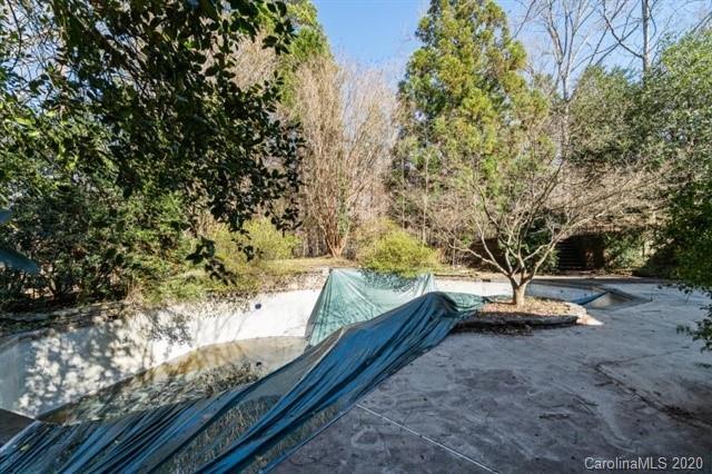 8355 Providence Road Charlotte, NC 28270 - Photo 34 of 36 a backyard of a house with table and chairs