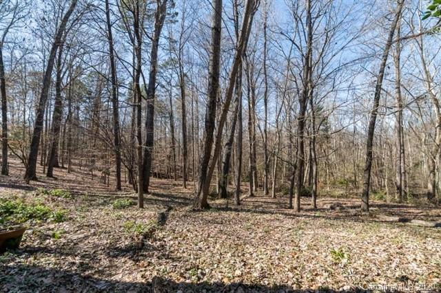 8355 Providence Road Charlotte, NC 28270 - Photo 35 of 36 a backyard of a house with lots of green space