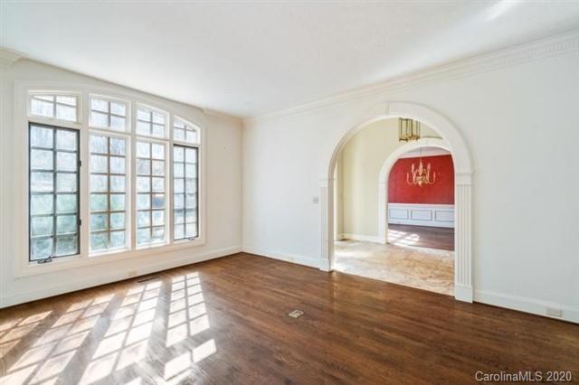 8355 Providence Road Charlotte, NC 28270 - Photo 5 of 36 an empty room with wooden floor and windows