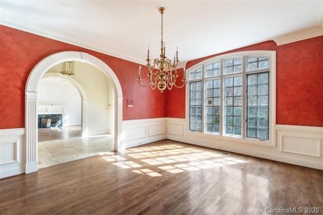 8355 Providence Road Charlotte, NC 28270 - Photo 6 of 36 a view of an empty room with window and wooden floor