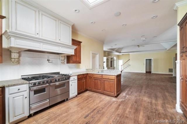 8355 Providence Road Charlotte, NC 28270 - Photo 9 of 36 a kitchen with stainless steel appliances granite countertop a stove and a sink