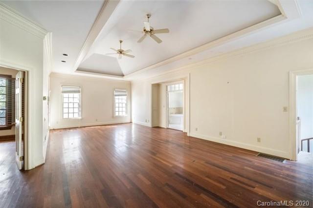 8355 Providence Road Charlotte, NC 28270 - Photo 10 of 36 a view of an empty room with window and wooden floor
