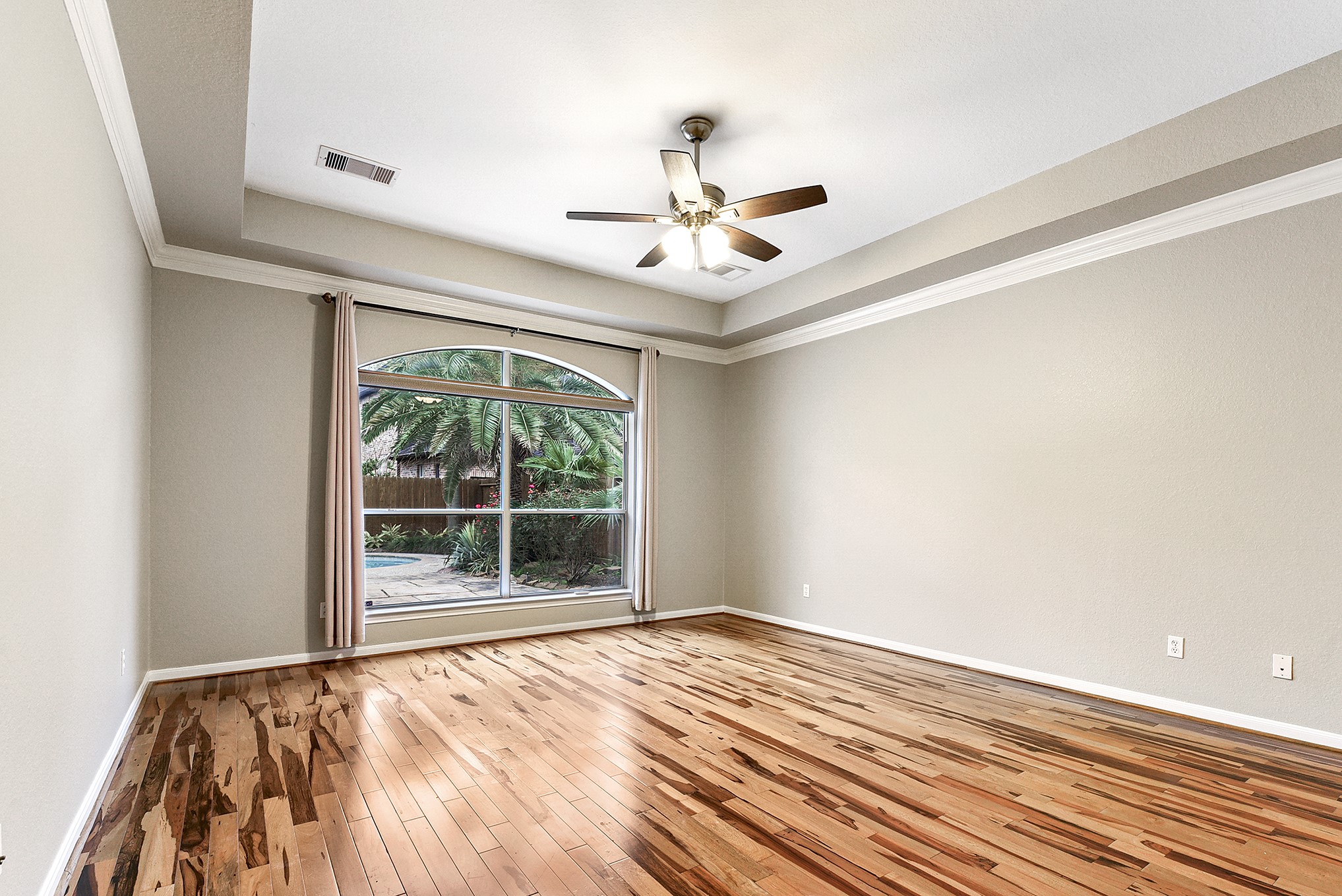 803 Chisel Point Drive Houston, TX 77094 - Photo 20 of 36 The primary bedroom, freshly painted with celing fan and beautiful crown molding.