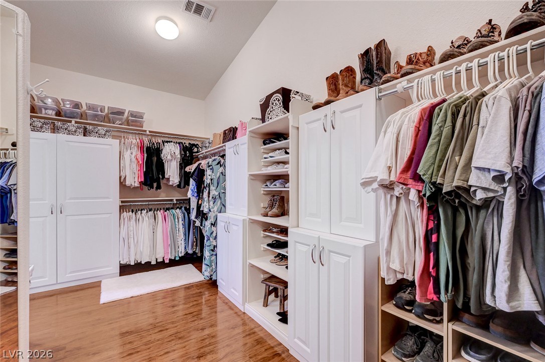 1604 Cattle Ranch Place Henderson, NV 89002 - Photo 47 of 99 Custom built-ins and ample hanging space create an organized dream wardrobe.
