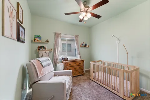 a bedroom with furniture and wooden floor