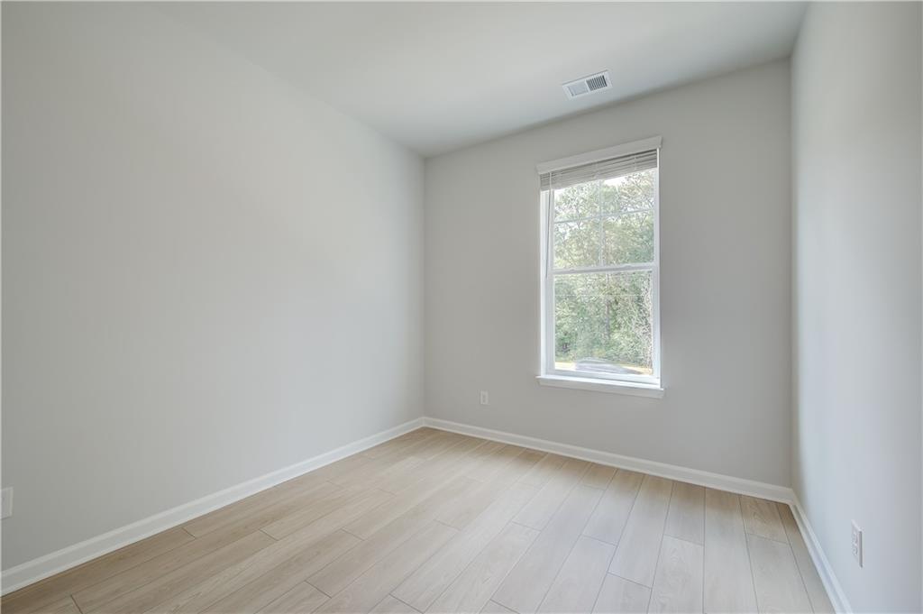 313 Daybreak Lane Newnan, GA 30265 - Photo 19 of 26 an empty room with a window