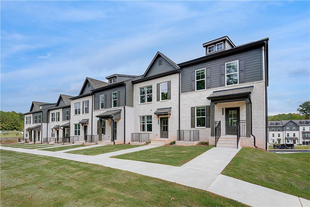 313 Daybreak Lane Newnan, GA 30265 - Photo 5 of 26 a front view of a house with a yard
